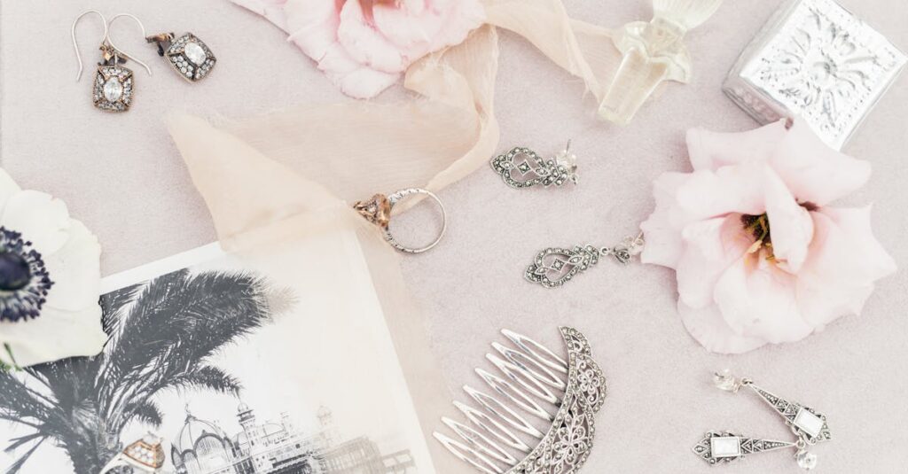 A delicate assortment of vintage jewelry and flowers in a flat lay composition.